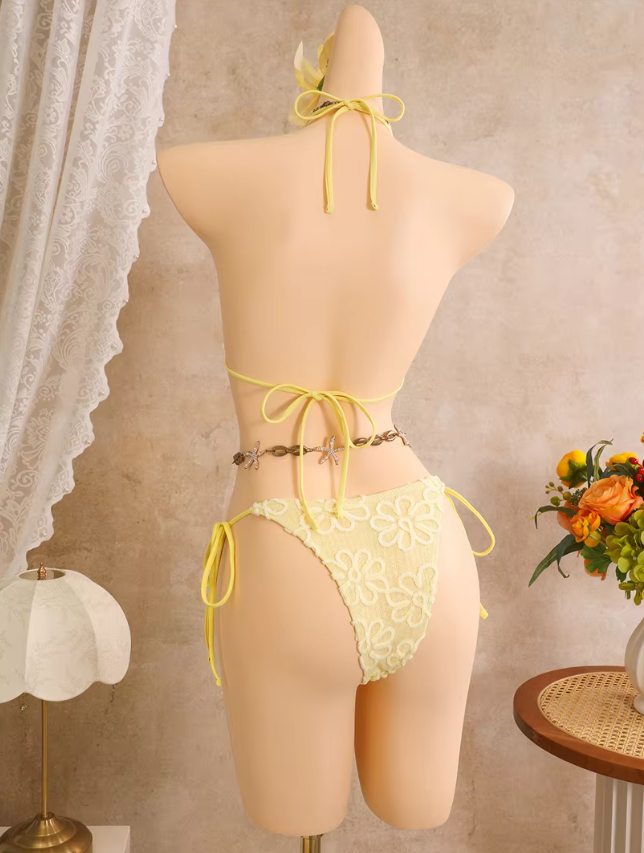 Back view of daffodil floral embroidered bikini set with adjustable halter tie, back tie and cheeky tie-side bottoms.