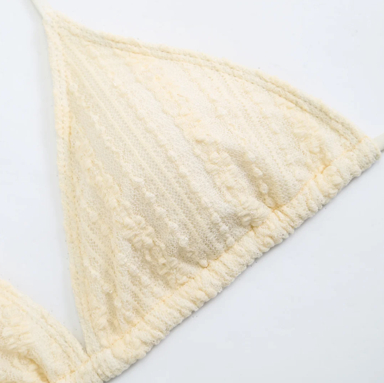 Close-up of the Cabo Bikini & Skirt Set bikini top in ivory, showing the textured fabric and triangle cup detail.
