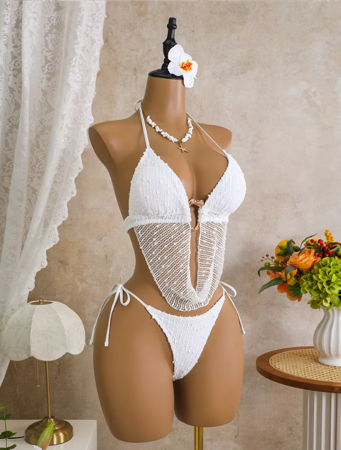 White textured bikini set displayed on mannequin with triangle halter top, draped mesh panel and gold-tone centre hardware.