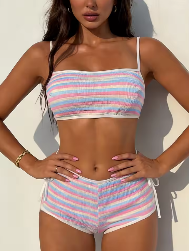 Close front view of pastel striped bikini with ribbed texture and contrast white binding.