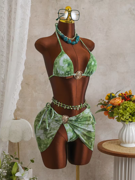 Angled front view of CURATOR Collection Capri green bikini and sheer sarong set with marbled print and gold-tone shell hardware.