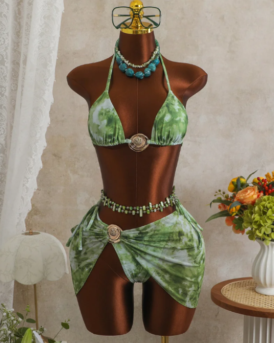 CURATOR Collection Capri green bikini and sheer sarong set worn by model with triangle halter top and gold-tone shell hardware.