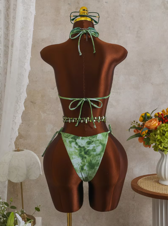 Back view of CURATOR Collection Capri green bikini set on mannequin with halter neck tie, back tie fastening and tie-side bottoms.