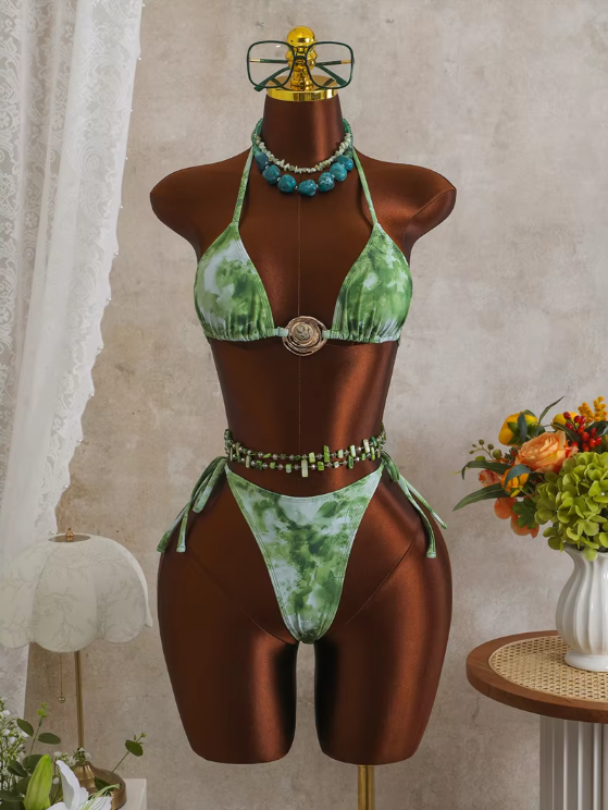 CURATOR Collection Capri green marbled bikini set displayed on mannequin with triangle halter top, shell ring hardware and tie-side bottoms.