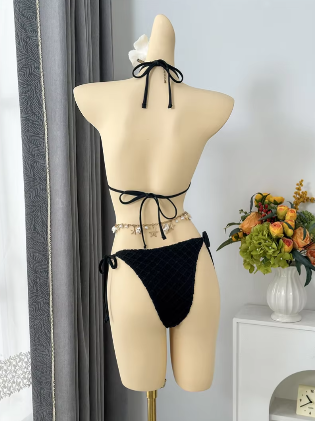 Back view of black textured halter bikini with adjustable neck, back and side ties.