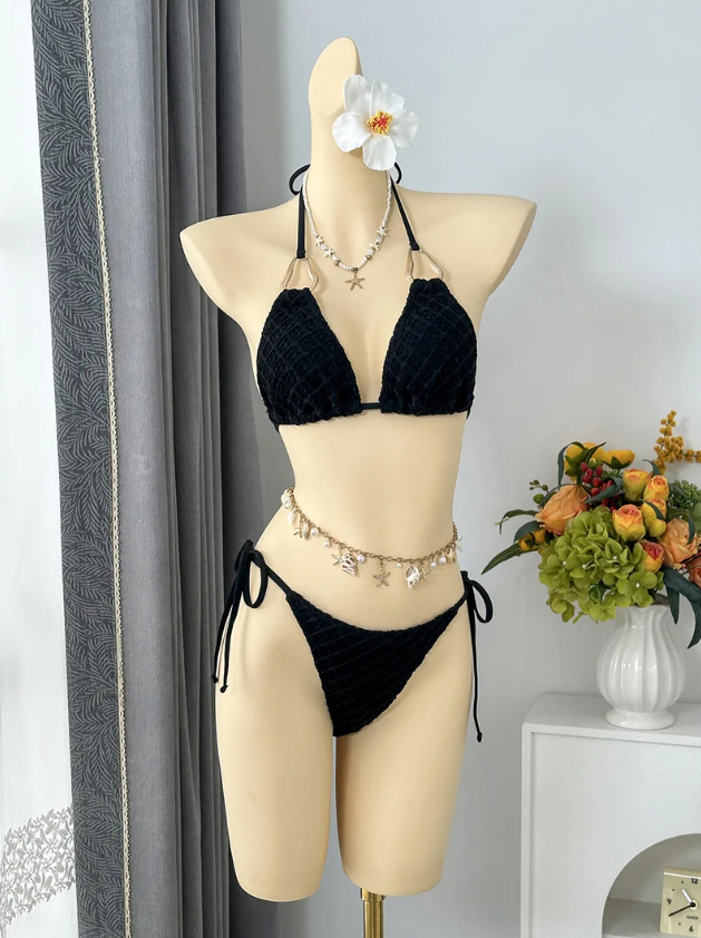 Black textured triangle halter bikini with tie-side bottoms displayed on mannequin.