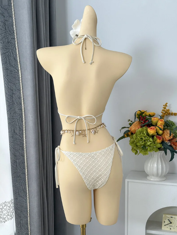 Back view of ivory textured halter bikini with adjustable neck, back and side ties.