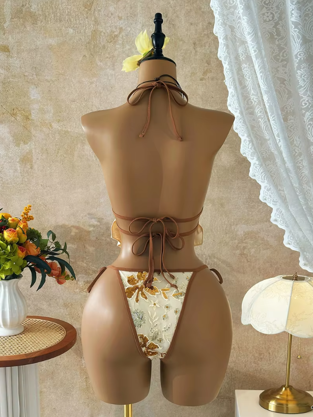 Back view of the CURATOR Collection Bijou Set in champagne, showing the halter neck tie, double back tie closures and matching high-cut tie-side bikini bottoms.