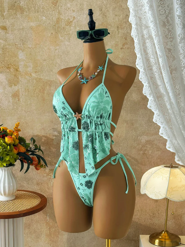 Angled front view of the CURATOR Collection Bijou Set in jade, showing the gathered peplum top, plunging neckline and high-cut tie-side bottoms.