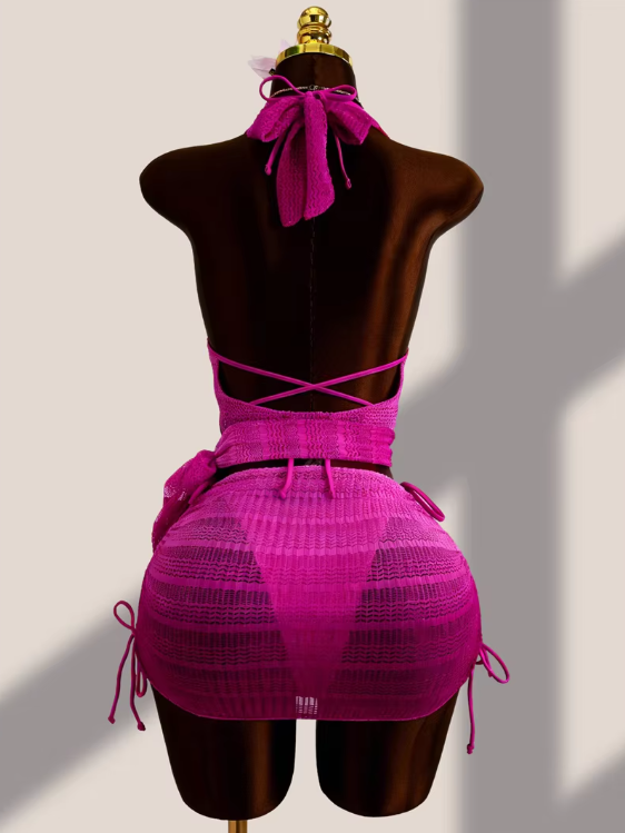 Back view of the Orchid Estelle Set with open back halter cover-up, ruched mini skirt and matching bikini ties.