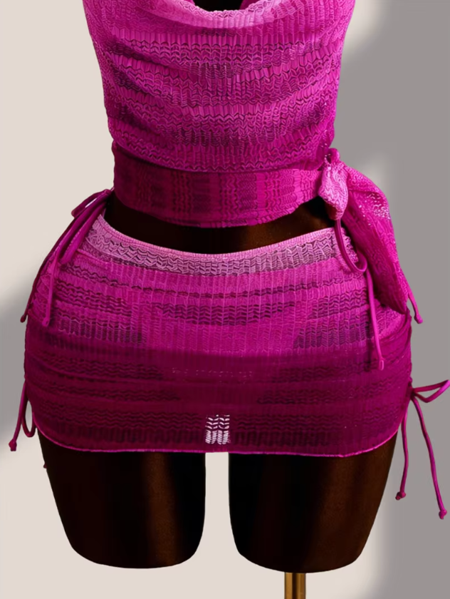 Close-up of the Orchid Estelle ruched mini skirt overlay with sheer pink texture and adjustable side ties.