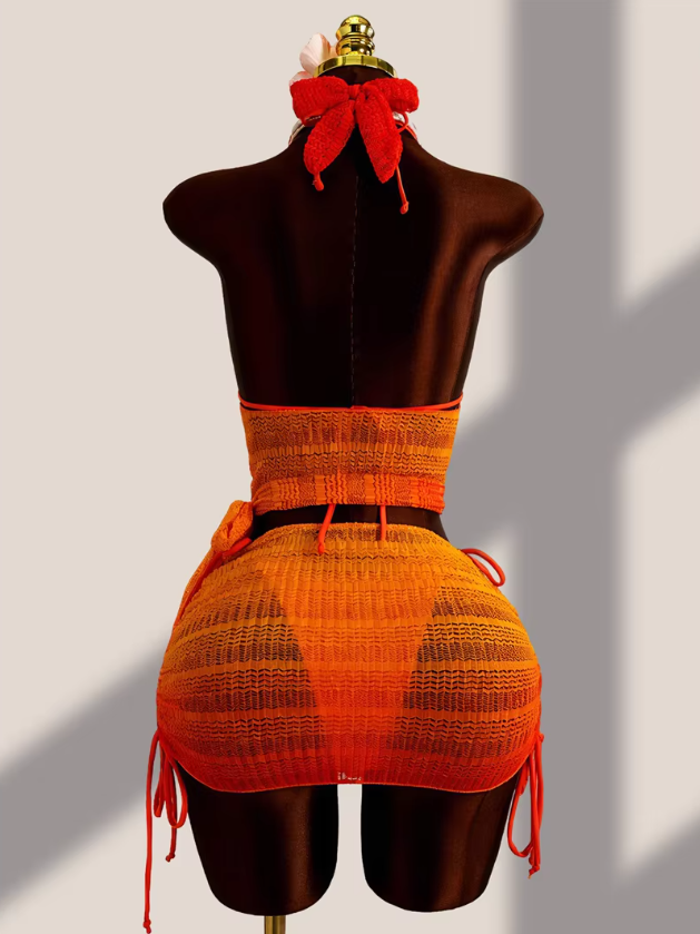 Back view of the Saffron Estelle Set with open back halter cover-up, ruched skirt overlay and matching bikini ties.