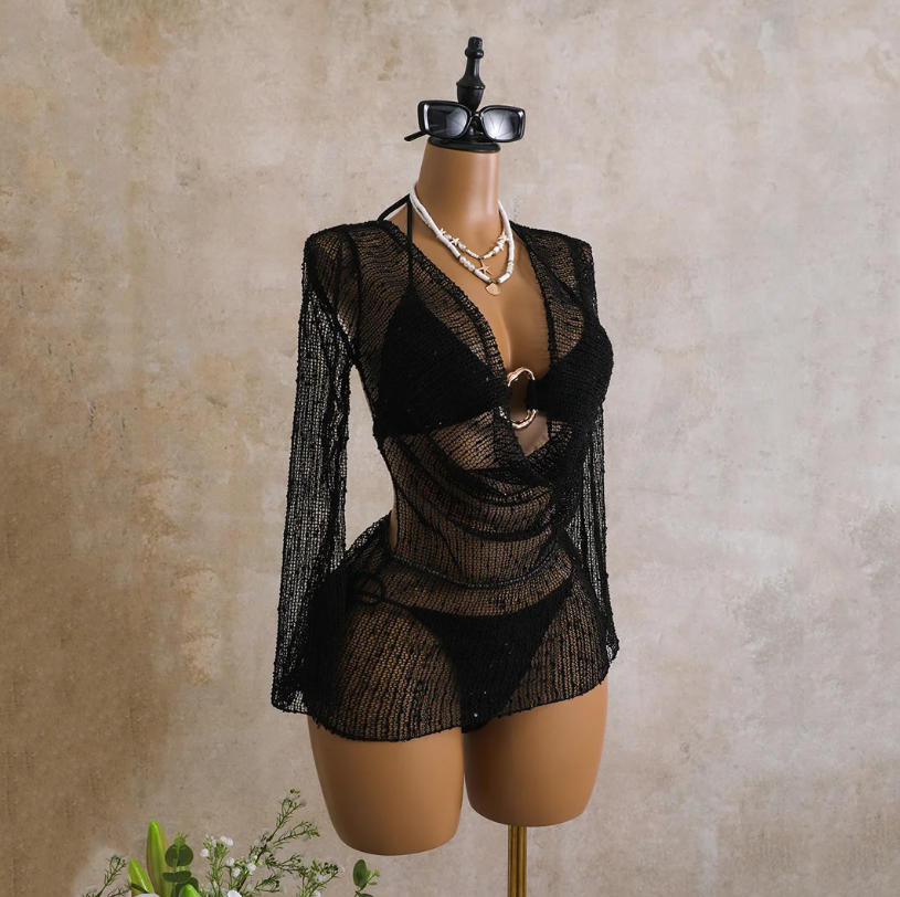 Angled front view of the black Milano Set cover-up with sheer open-knit texture, long sleeves and plunging draped front.