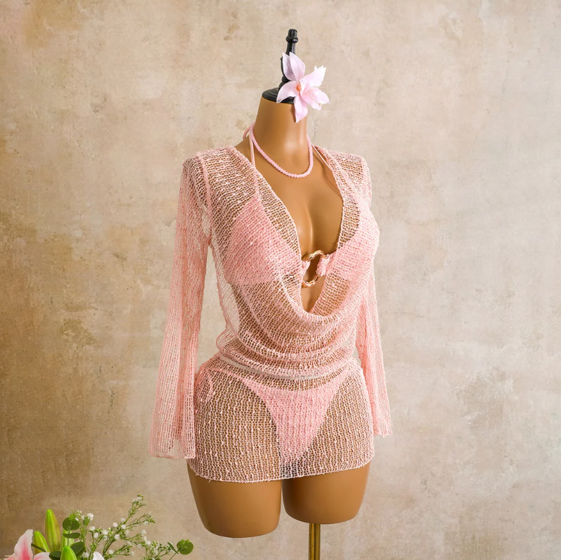 Angled front view of the camellia Milano Set cover-up with sheer open-knit texture, long sleeves and plunging draped front.
