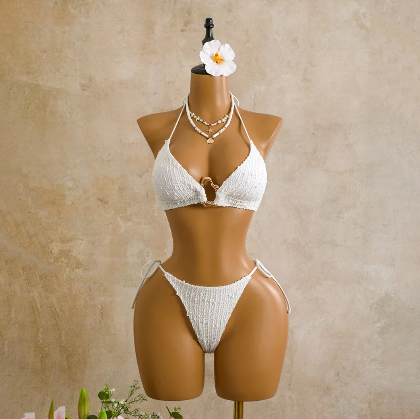 Ivory Milano Set bikini front view on mannequin with textured triangle halter top, centre ring detail and matching tie-side bottoms.