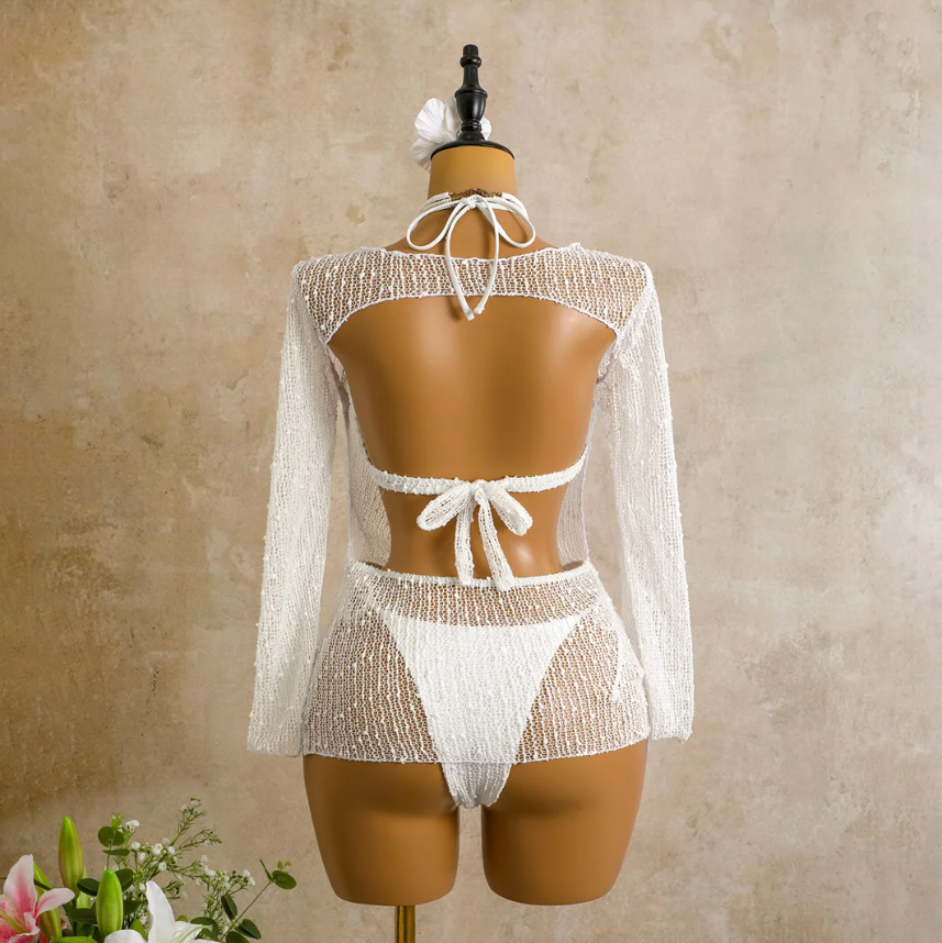 Back view of the ivory Milano Set cover-up on mannequin, showing the open back detail, tie closure and sheer open-knit finish.