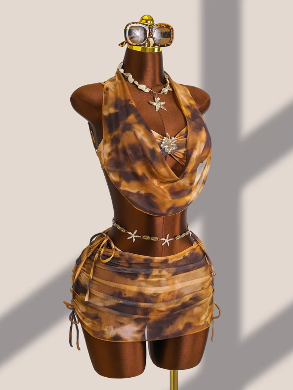 Full front mannequin view of the CURATOR Collection Moonstone Set with sheer draped halter overlay, ruched mini skirt and matching bikini.
