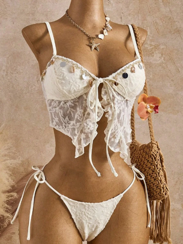 White CURATOR Collection Sangria Set displayed on mannequin with lace cami top, front tie detail and tie-side bottoms.