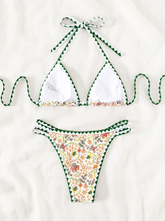 Dominica white botanical floral bikini set back view flat lay with triangle top and high-leg bottoms.
