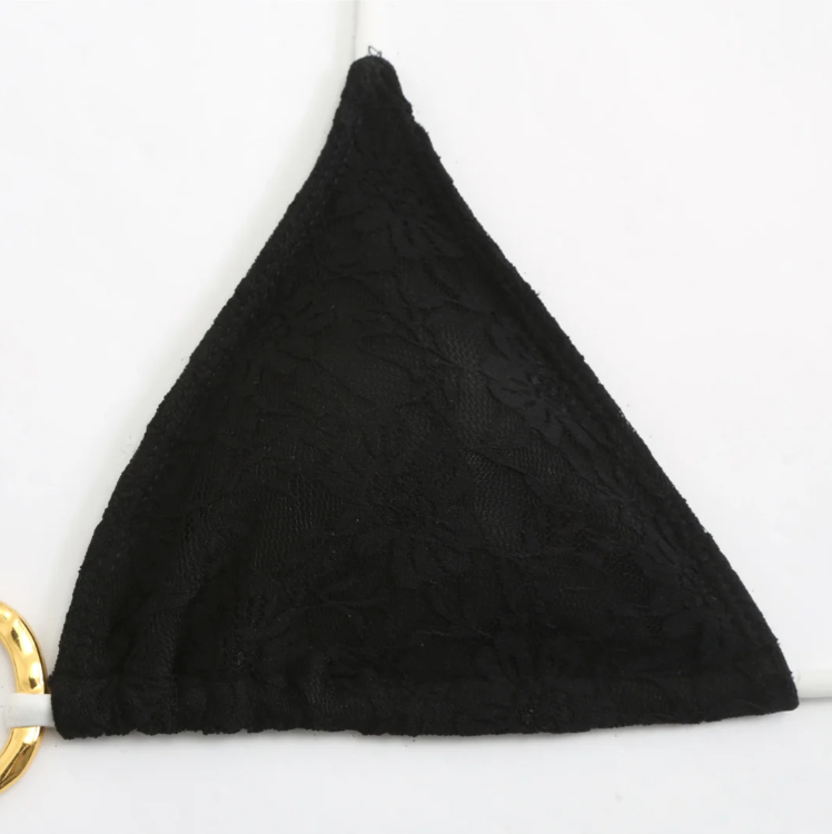 Close-up of the Grenada Bikini & Skirt Set bikini top in black, showing the floral lace texture and triangle cup detail.