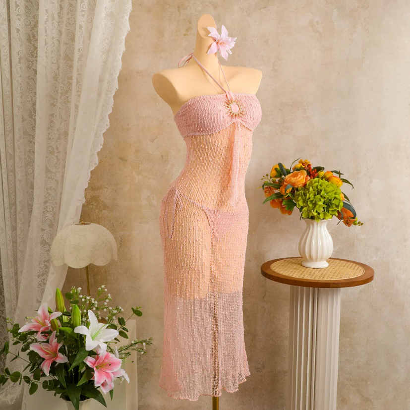 Angled mannequin view of camellia sheer openwork halter dress set with sculptural sun hardware.
