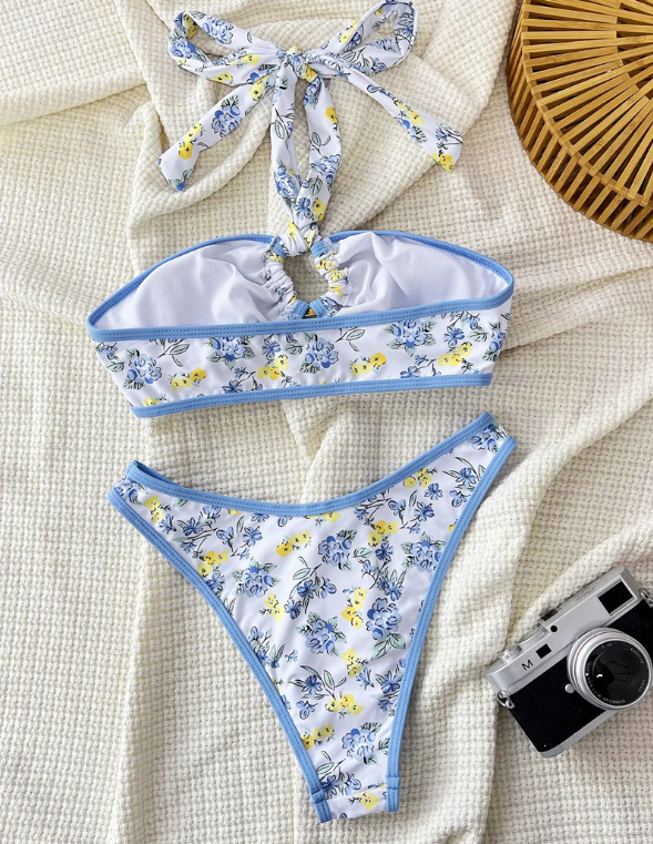 Back flat lay of blue floral bikini set with wide halter neck tie, lined bandeau top and matching high-leg bottoms.