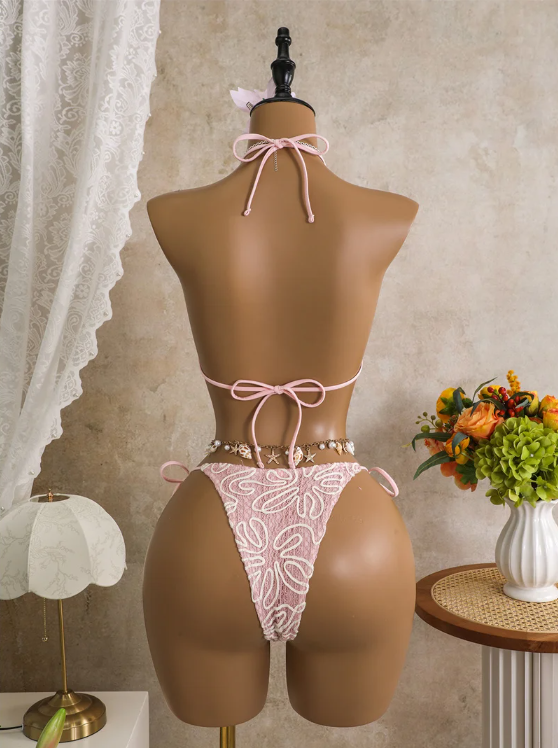 Back view of pink embroidered bikini set with adjustable halter tie, back tie and cheeky tie-side bottoms.