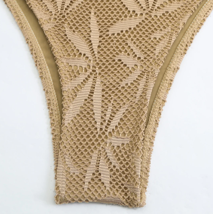 Close-up of the Ravello Bikini & Skirt Set bikini bottoms in taupe, showing the crochet-look texture and high-cut shape.