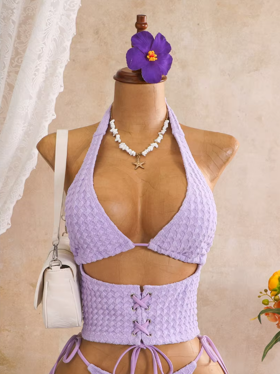 Close-up of lilac textured halter bodice with sculpted front cut-out and lace-up waist panel.
