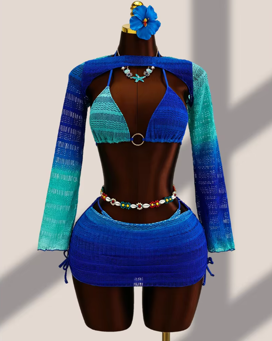 Aqua ombré crochet-look bikini, sheer long-sleeve bolero and matching mini skirt set displayed on mannequin.