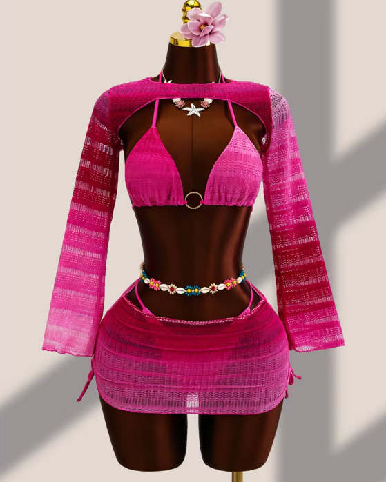 fuschia ombré crochet-look bikini, sheer long-sleeve bolero and matching mini skirt set displayed on mannequin.
