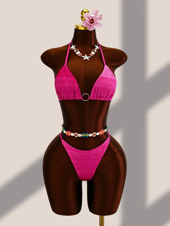 Fuschia crochet-look triangle bikini set with centre ring hardware and high-leg bottoms displayed on mannequin.