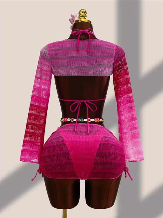 Back view of fuschia ombré crochet-look bikini, sheer bolero and mini skirt set with adjustable ties.