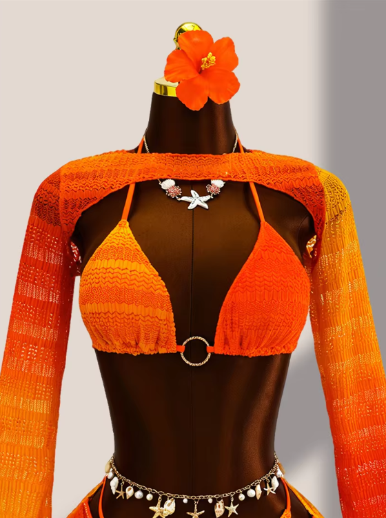 Close-up of tangerine crochet-look bikini top with centre ring hardware and matching ombré bolero.