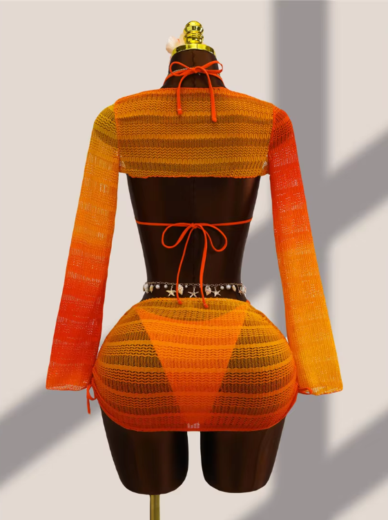 Back view of tangerine ombré crochet-look bikini, sheer bolero and mini skirt set with adjustable ties.
