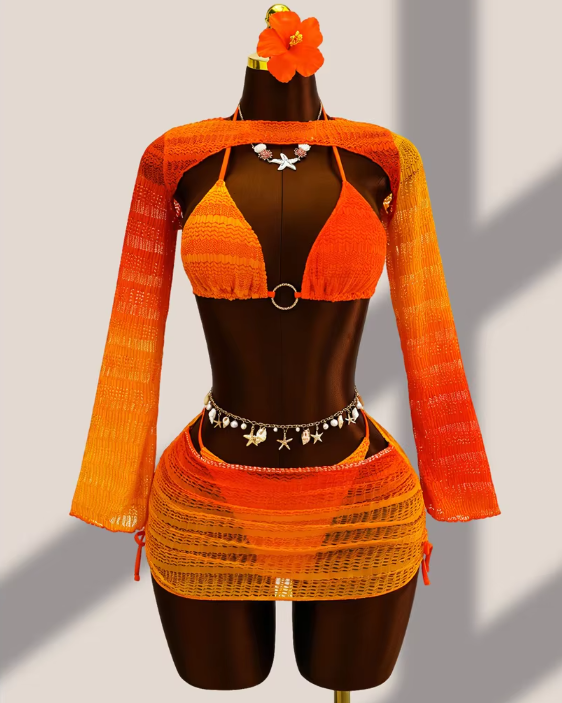 Tangerine ombré crochet-look bikini, sheer long-sleeve bolero and matching mini skirt set displayed on mannequin.