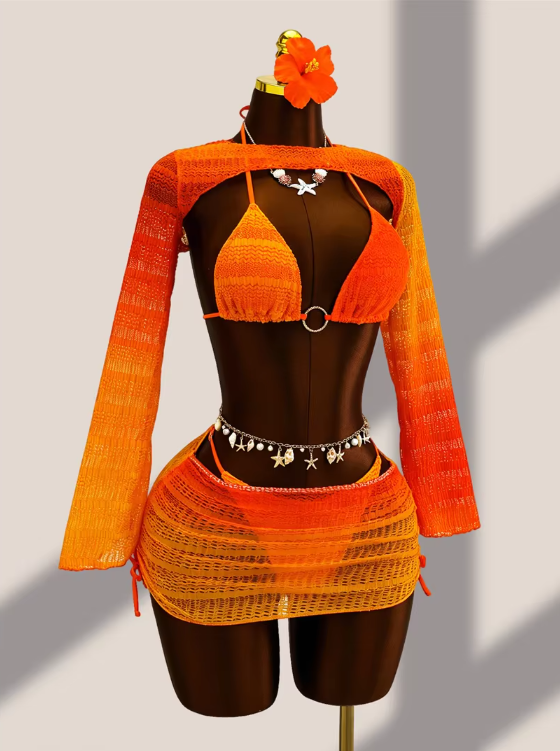Angled front view of tangerine ombré bikini and sheer mini skirt set with long-sleeve crochet-look bolero.