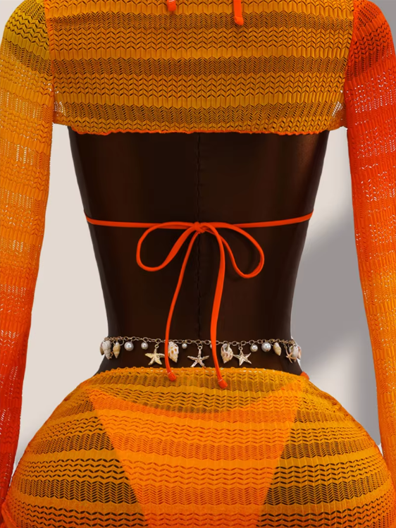 Close-up back view of tangerine ombré crochet-look bolero, bikini back tie and sheer mini skirt overlay.