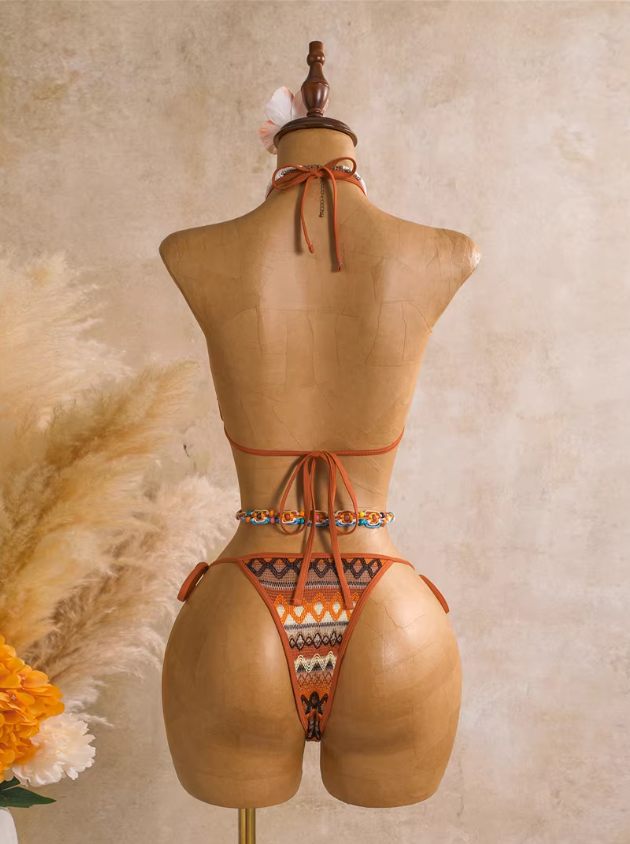 Back view of saffron orange triangle bikini set with halter neck tie, back tie and tie-side bottoms.