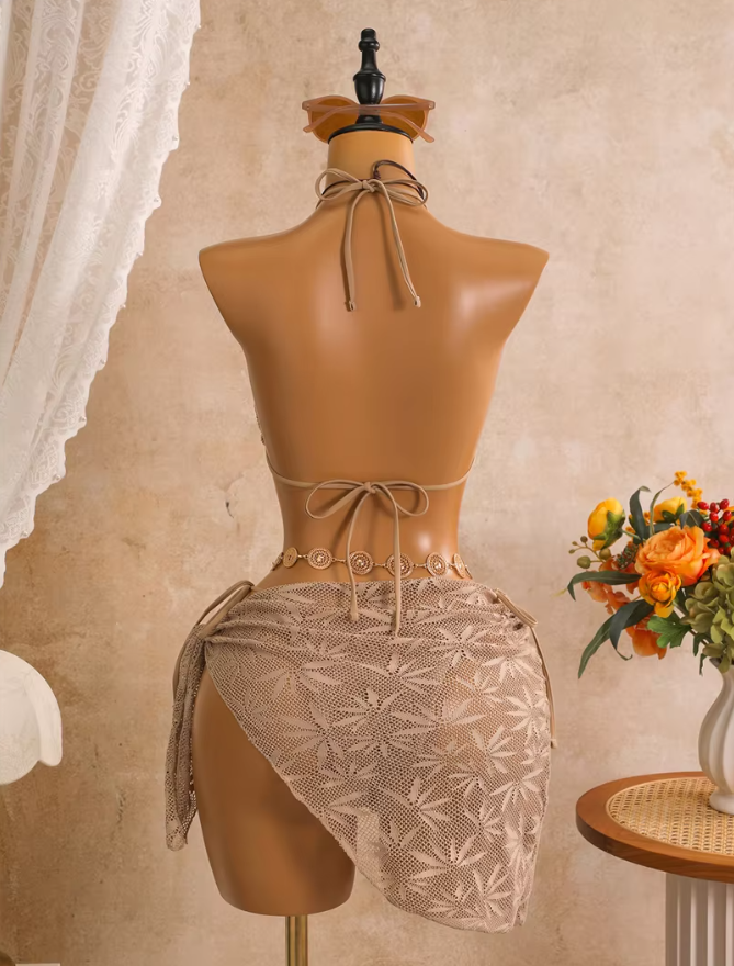 Back view of dune openwork bikini and matching wrap sarong with halter neck tie and back tie fastening.
