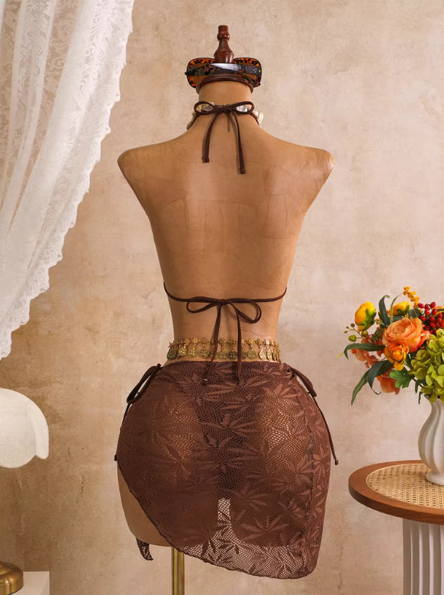 Back view of mocha openwork bikini and matching wrap sarong with halter neck tie and back tie fastening.