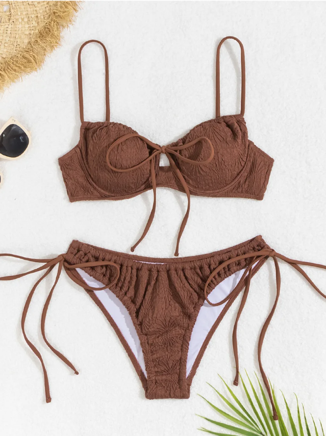 Flat lay front view of chocolate brown textured bikini set with underwired tie-front top and matching tie-side bottoms.