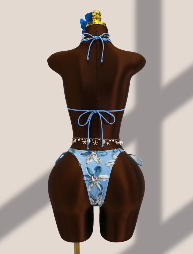 Back view of aqua floral appliqué bikini set with adjustable halter tie, back tie and cheeky tie-side bottoms.