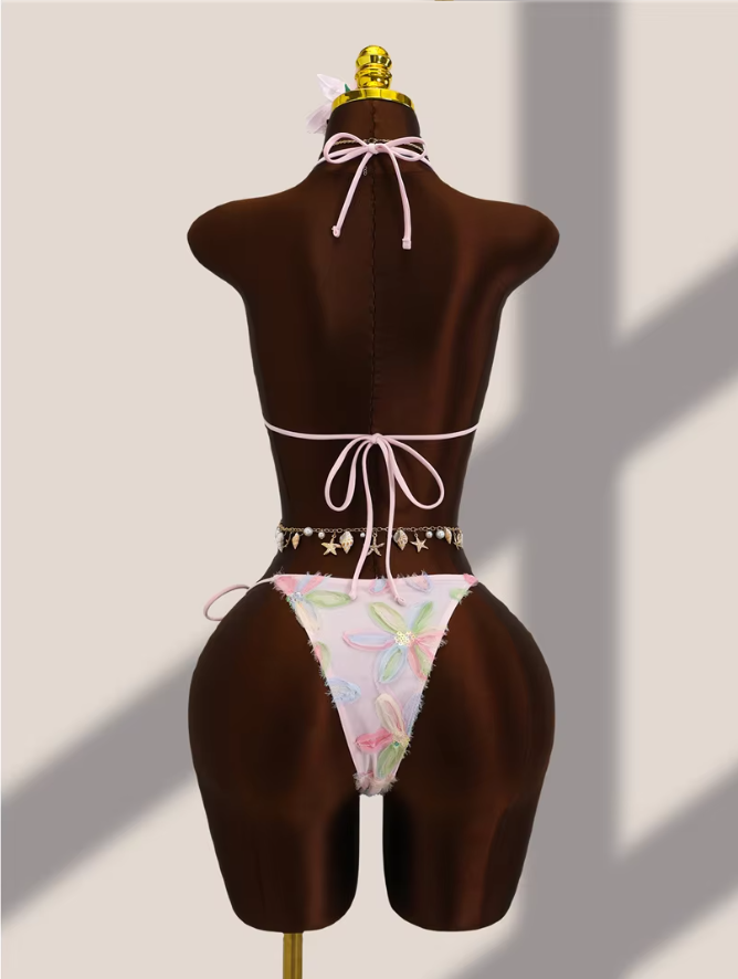 Back view of pink floral appliqué bikini set with adjustable halter tie, back tie and cheeky tie-side bottoms.