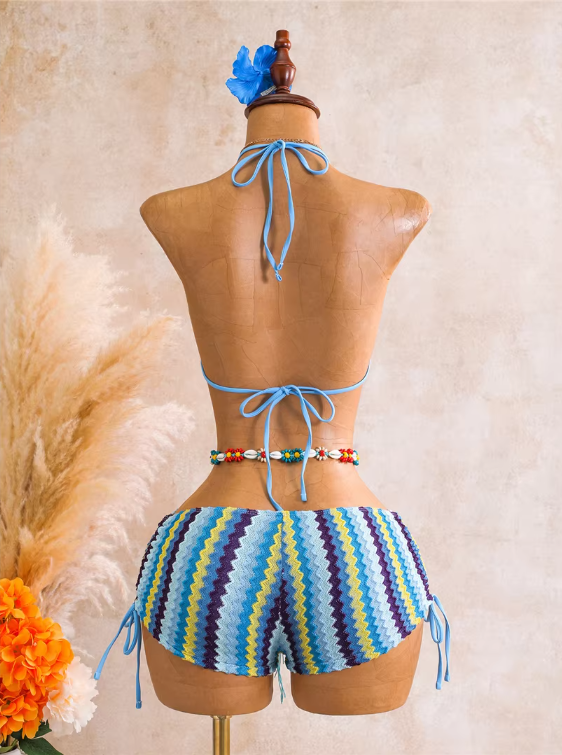 Back view of aqua chevron swim set with halter neck tie, back tie and side-tie shorts.