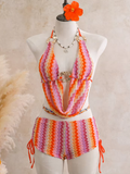 Flamingo crochet-look chevron swim set with halter scarf top and side-tie shorts on mannequin.