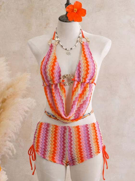 Flamingo crochet-look chevron swim set with halter scarf top and side-tie shorts on mannequin.