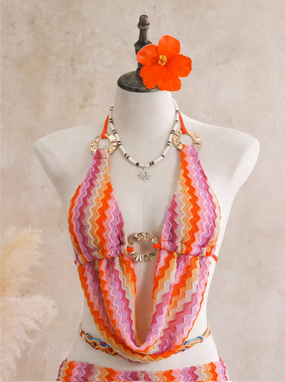 Close-up of flamingo crochet-look chevron halter top with gold-tone ring hardware and shell accents.