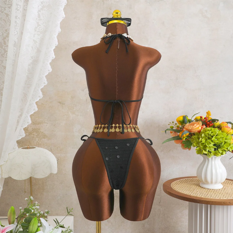 Back view of black crochet-look bikini set with adjustable halter tie, back tie and minimal high-leg bottoms.