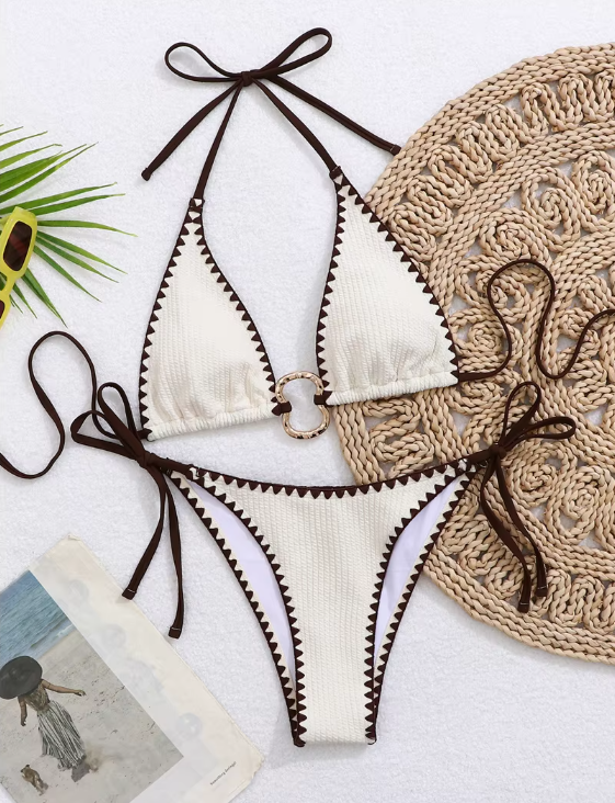 Ivory Zinnia Bikini Set flat lay with mocha contrast scalloped trim, halter top and matching tie-side bottoms.